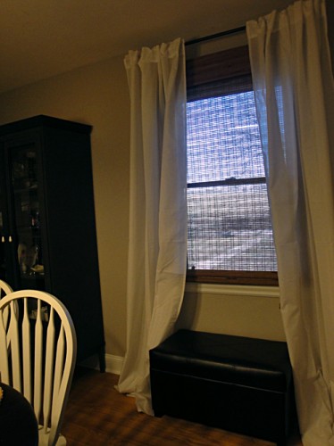 dining room with ikea curtains and overstock roman shades